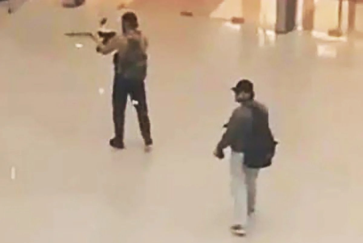 Shooters seen on CCTV cameras inside the concert venue. Screenshot