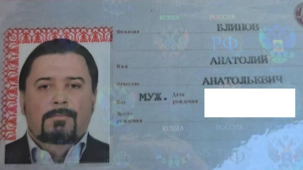 Anatoly Blinov’s partially redacted passport photo page. Photo: FBK