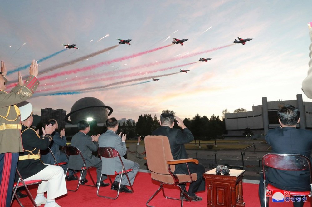 North Korean dictator Kim Jong Un (C) views a fighter jet fly-by in Pyongyang, North Korea, 11 October 2021. Photo: EPA-EFE/KCNA