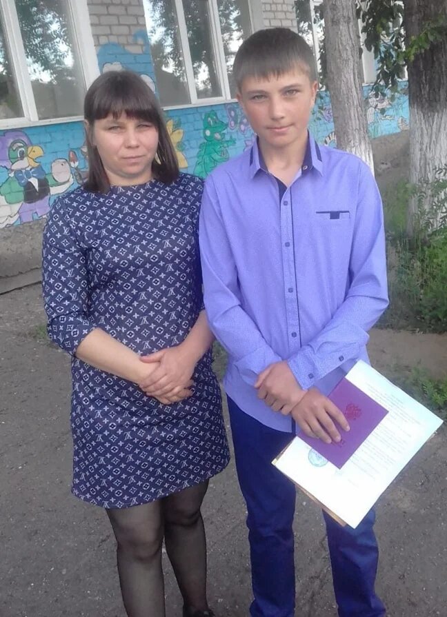 Alexey and his mother at his middle school graduation. A photo from the family archive