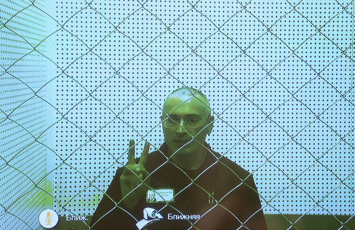 A screen in the Russian Supreme Court shows the former Yukos owner Mikhail Khodorkovsky attending an appeal hearing from his penal colony in the republic of Karelia. 6 August 2013. Photo: Sergey Ilnitsky / ЕРА