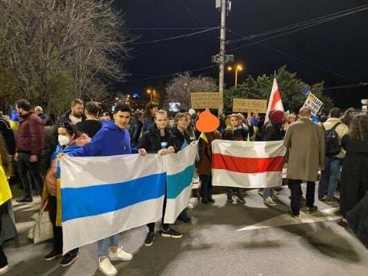 Activists hold the white-blue-white flag, considered a symbol of the Russian anti-war movement, and the white-red-white flag, symbolising a free Belarus, at a rally in Sofia. Photo from personal archive