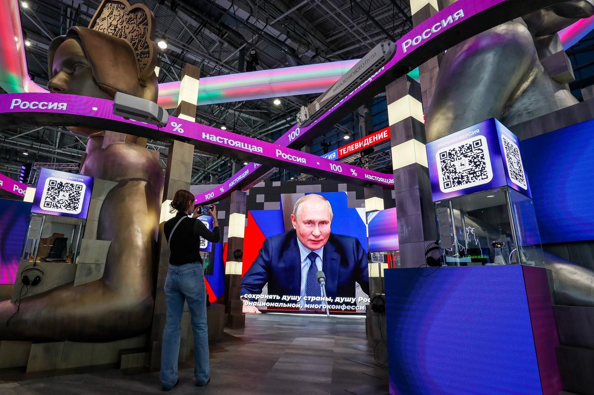 A speech by Russian President Vladimir Putin is played at the International Exhibition-Forum Russia in Moscow. Photo: EPA-EFE / YURI KOCHETKOV