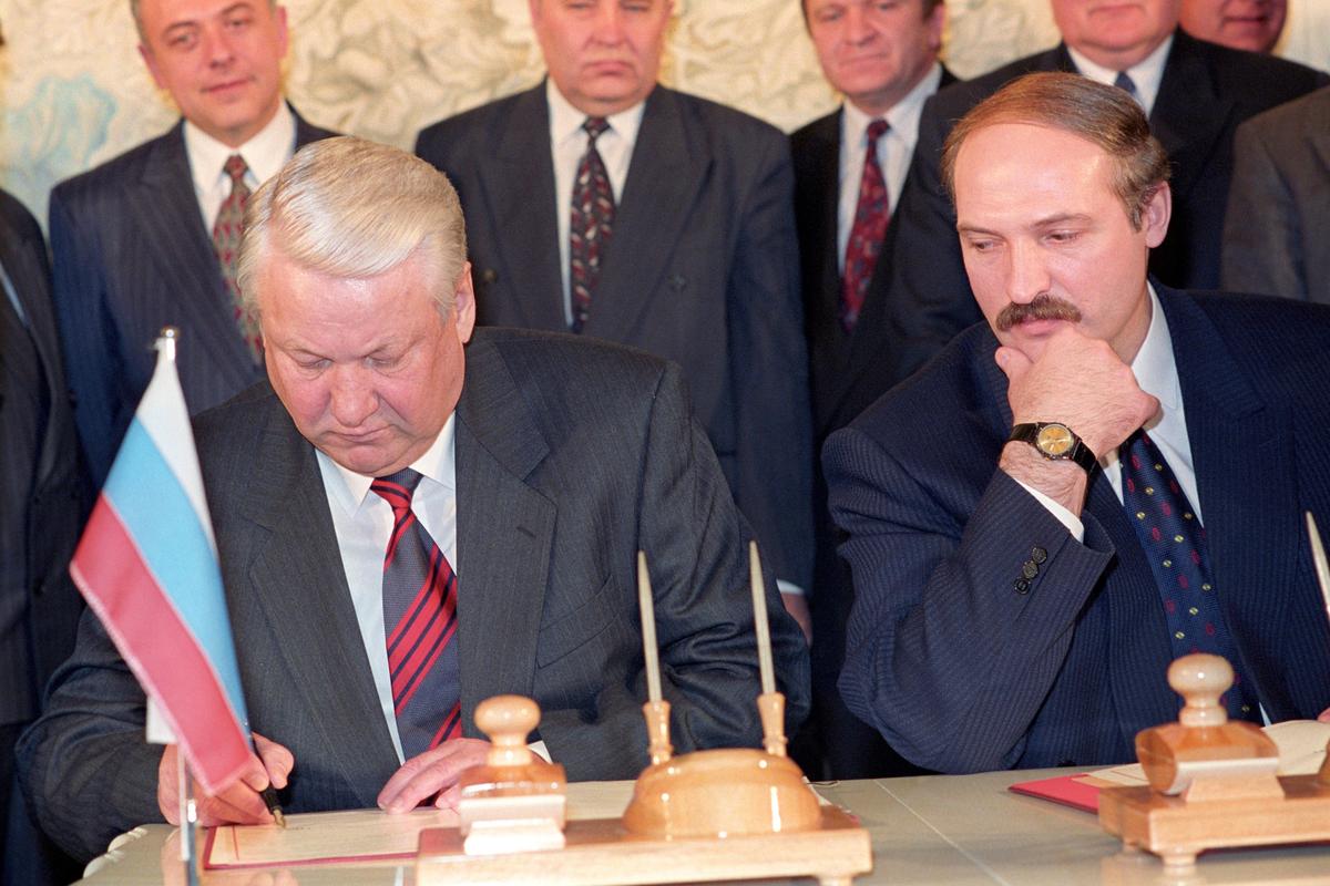 Lukashenko looks on as Russian President Boris Yeltsin signs the Contract on Friendship, Neighbourliness and Cooperation in Minsk, Belarus, 22 February 1995. EPA/VIKTOR DRACHEV