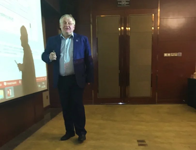 Dmitry Kolker during a lecture on laser physics in Guiyang, China. Photo from Dmitry Kolker’s VK page