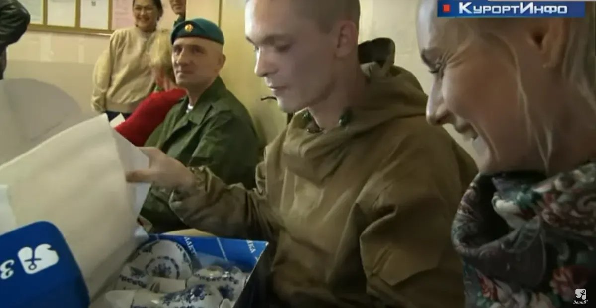 A conscript receiving the gift tea set. Screenshot from the video
