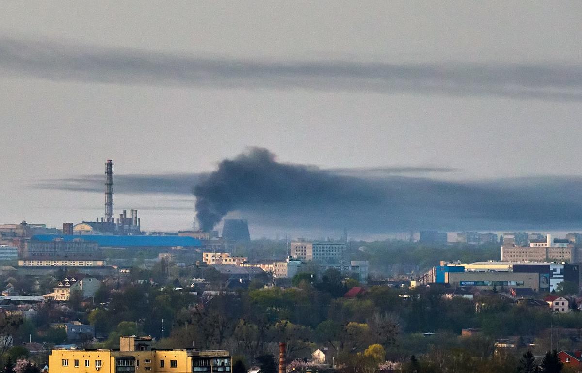 Smoke rises over Kharkiv following a rocket attack, 11 April 2024. EPA-EFE/SERGEY KOZLOV