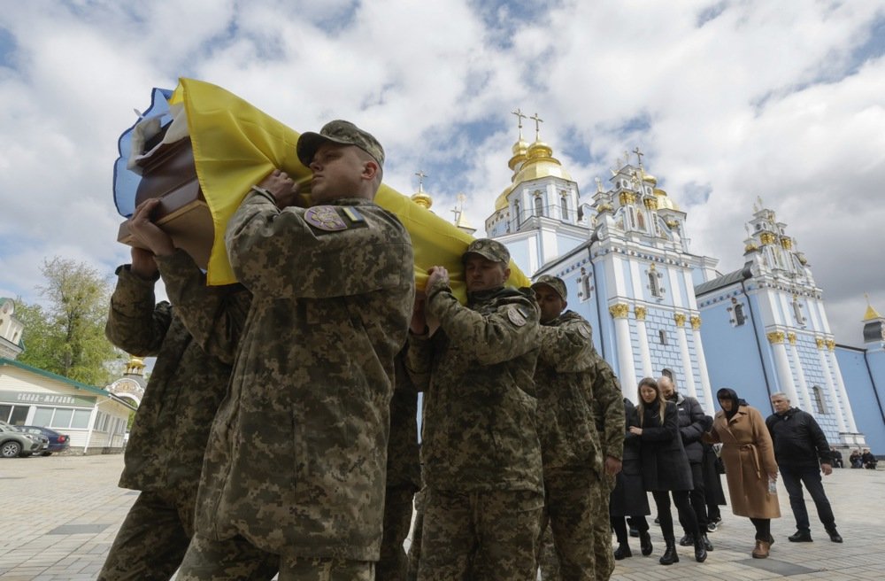 A funeral service held for Ukrainian serviceman Pavlo Petrychenko in Kyiv in April. Photo: EPA-EFE/SERGEY DOLZHENKO