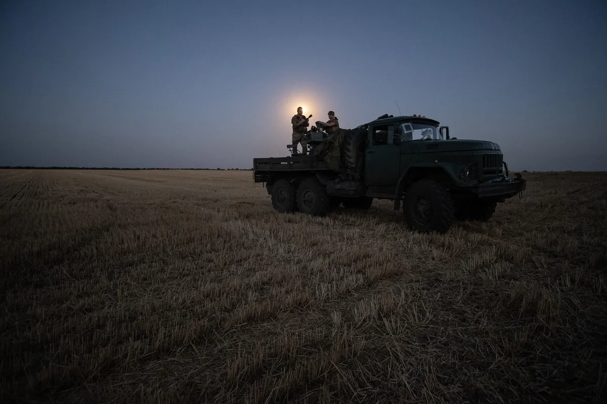 Two soldiers from a Ukrainian anti-aircraft artillery brigade scan their sector for Shahed drones on Ukraine's southern frontline, 8 July 2025. Photo: EPA / Maria Senovilla