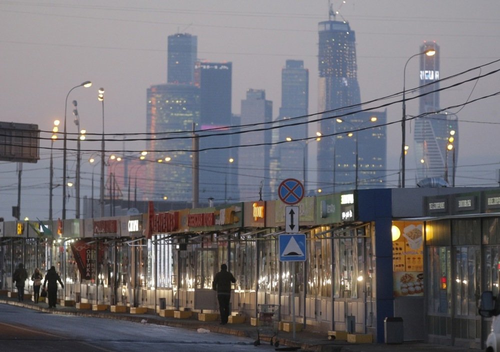 Temporary structures housing shops and cafes are dwarfed by the skyscrapers of Moskva City, 3 December 2014. Photo: EPA / MAXIM SHIPENKOV