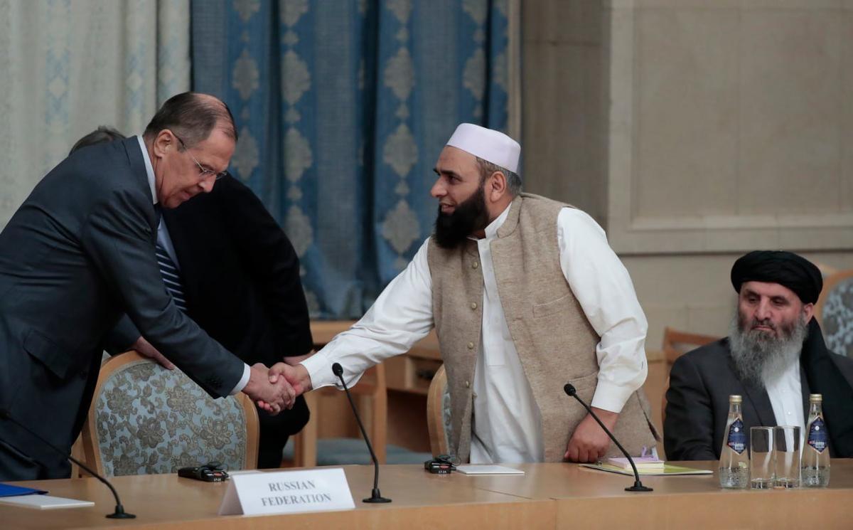 Russian Foreign Minister Sergey Lavrov and a Taliban representative attend a meeting in Moscow. Photo: EPA-EFE