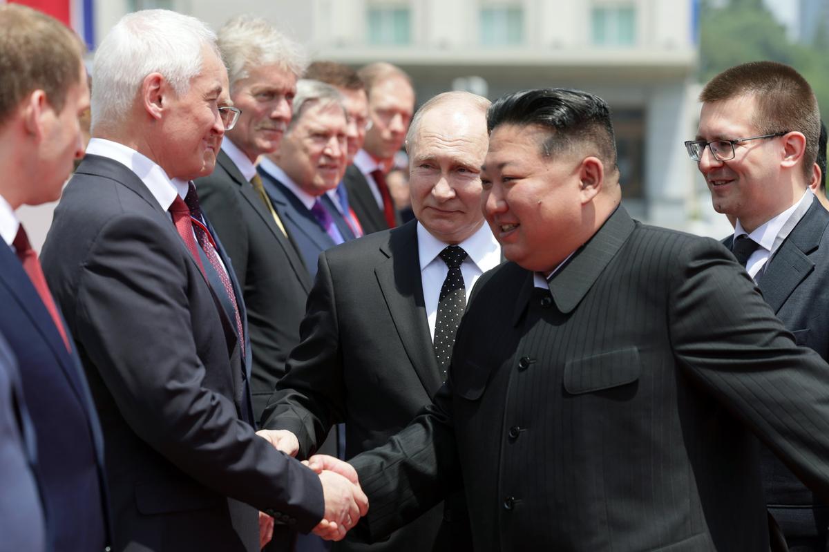 Kim Jong Un shakes hands with Russian Defence minister Andrey Belousov during the official welcome ceremony, 19 June 2024. Photo: EPA-EFE /GAVRIIL GRIGOROV / SPUTNIK / KREMLIN POOL