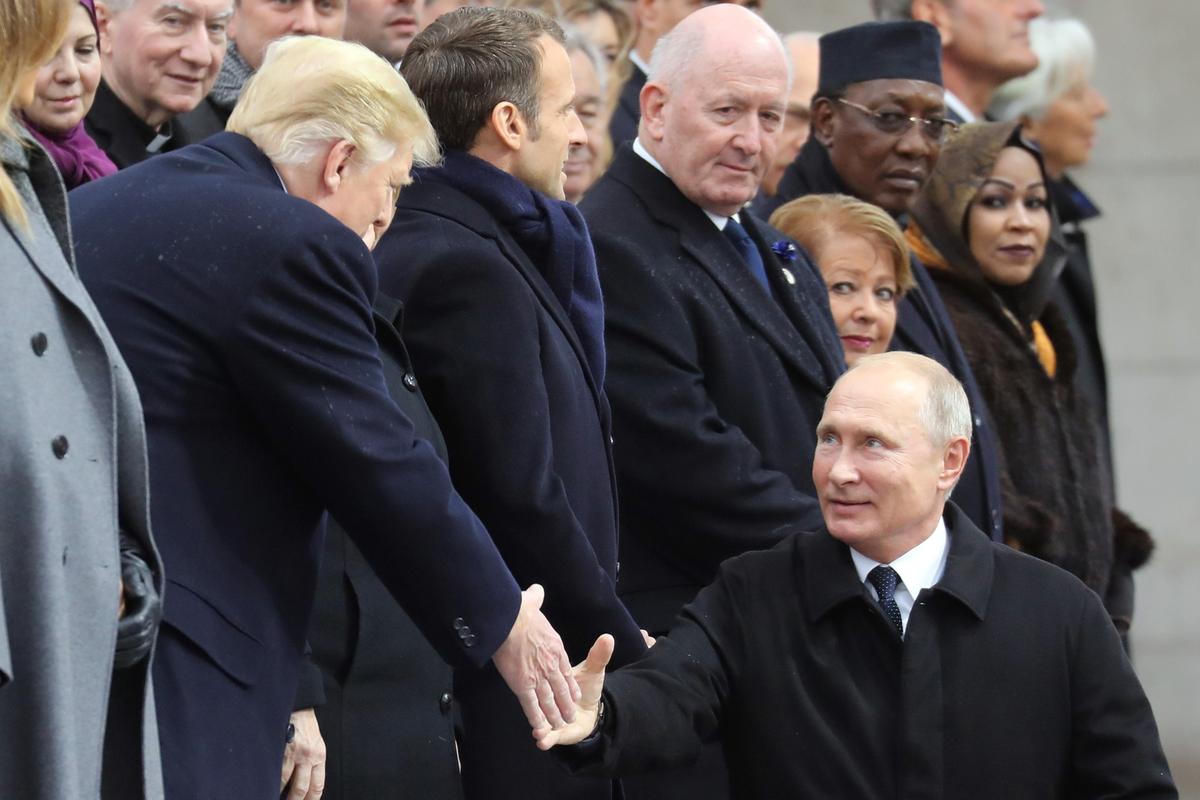 Vladimir Putin shakes hands with US President Donald Trump at the centenary of the WWI armistice at the Arc de Triomphe in Paris, 11 November 2018. Photo: EPA-EFE/LUDOVIC MARIN/POOL