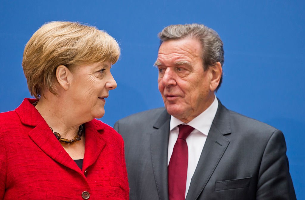 Angela Merkel and Gerhard Schröder. Photo: Michael Gottschalk/Photothek via Getty Images