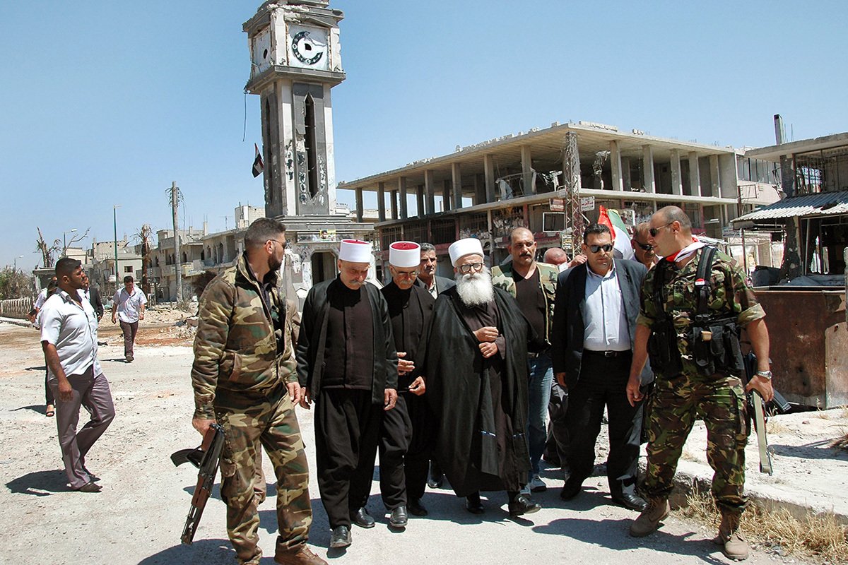 Делегация священнослужителей посещает Аль-Кусейр, чтобы выразить солидарность с сирийской армией, 16 июня 2013 г. Фото: STR/ EPA