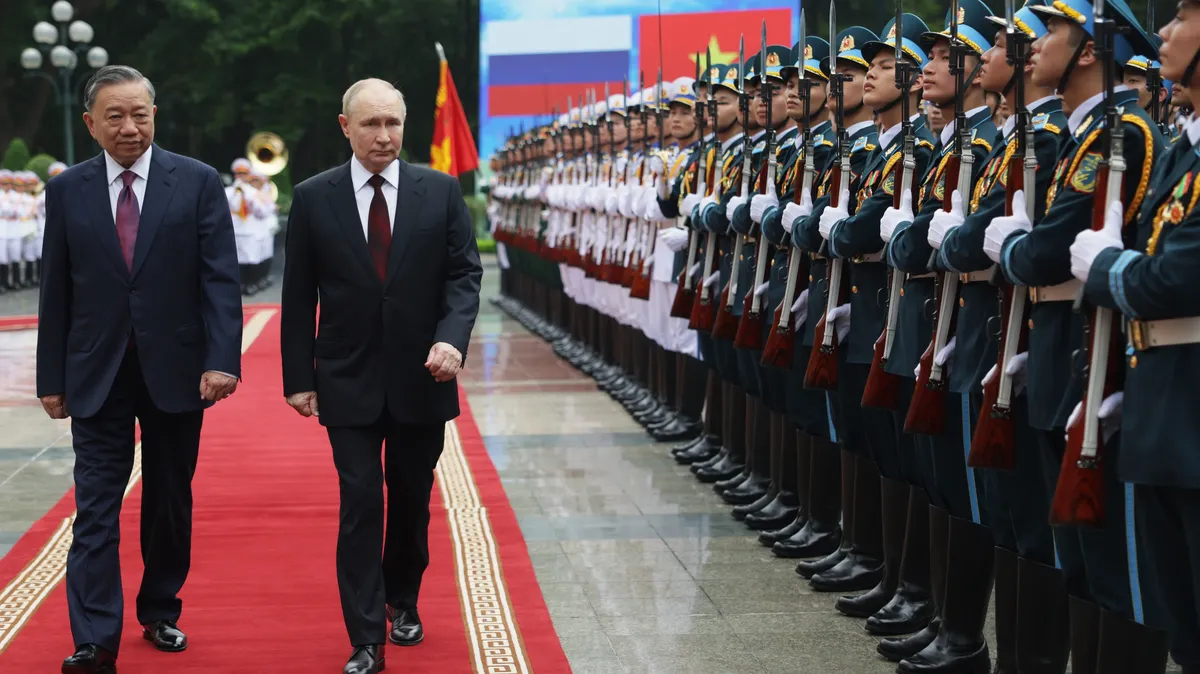 Russian President Vladimir Putin (R) and Vietnamese President To Lam (L) attend a welcoming ceremony outside the Presidential Palace in Hanoi, Vietnam, 20 June 2024. Putin is on an official visit to Vietnam following his visit to North Korea. EPA-EFE/GAVRIIL GRIGOROV/SPUTNIK/KREMLIN POOL MANDATORY CREDIT