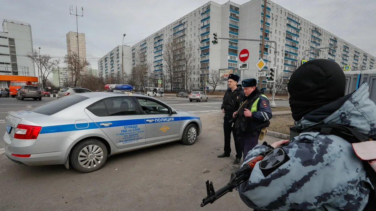 Police officers stationed near the site of the Moscow concert hall attack. Photo: EPA-EFE/YURI KOCHETKOV