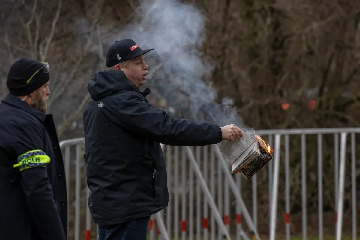 Paludan burning the holy book of Islam in Stockholm, 21 January. Photo: Jonas Gratzer / Getty Images