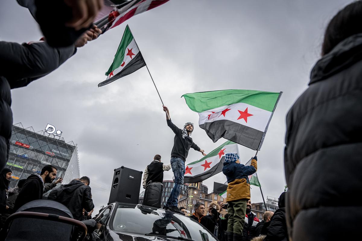 Syrians celebrate the rebel takeover of Damascus, in Copenhagen, Denmark, 8 December 2024. Photo: EPA-EFE / EMIL HELMS