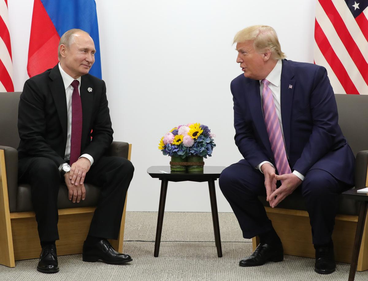 Happier times: Russian President Vladimir Putin and US President Donald Trump meet at the G20 leaders summit in Osaka, Japan, 28 June 2019. Photo: EPA-EFE / MICHAEL KLIMENTYEV / SPUTNIK