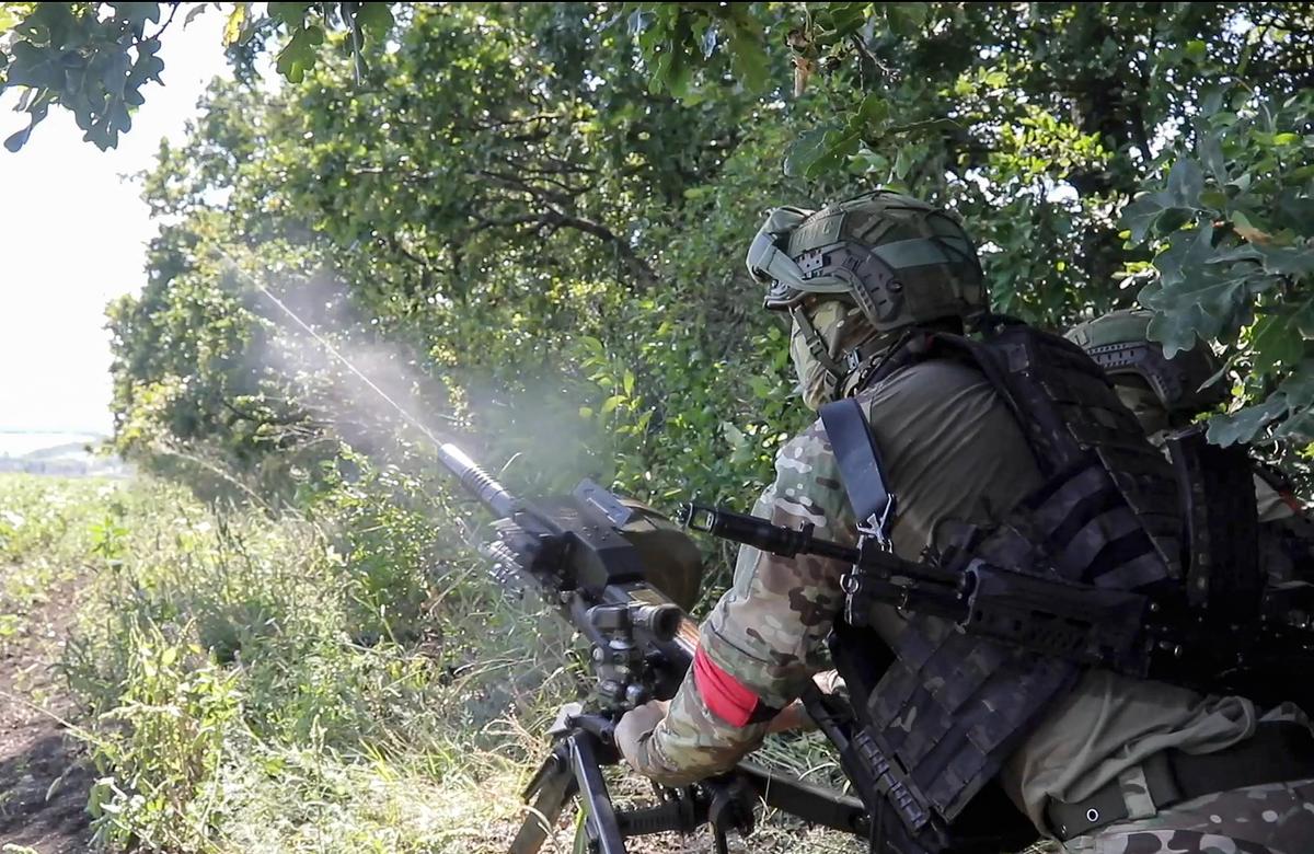 A Russian serviceman firing an automatic grenade launcher towards Ukrainian positions at an undisclosed location. Photo: EPA-EFE / RUSSIAN DEFENCE MINISTRY