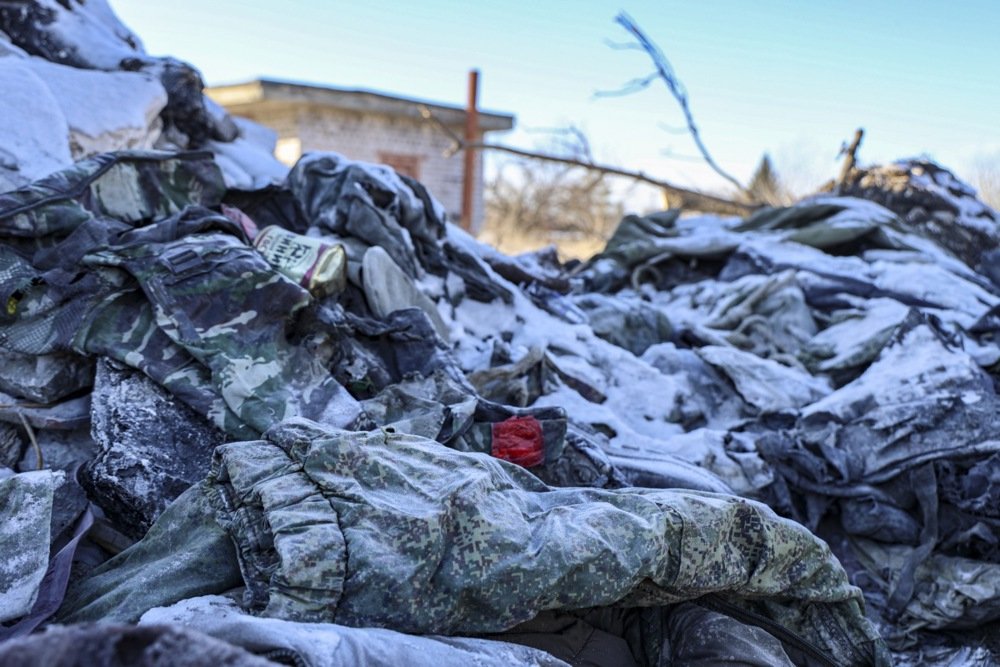 Russian uniforms lie among the rubble of a vocational school that Russian servicemen used as barracks, in Makiivka, in Ukraine’s Donetsk region, 11 January 2023. Photo: EPA-EFE/ALESSANDRO GUERRA