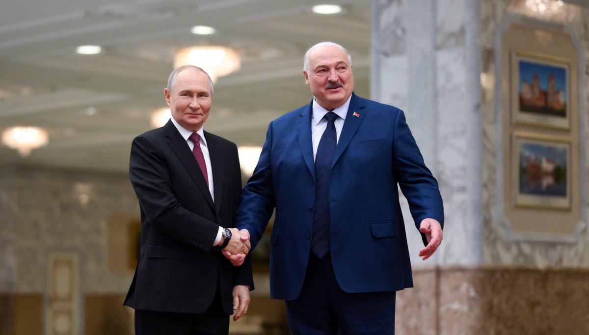 Vladimir Putin shakes hands with Alexander Lukashenko before a meeting in Minsk on Friday. Photo: EPA-EFE/GRIGORY SYSOYEV / SPUTNIK / KREMLIN POOL