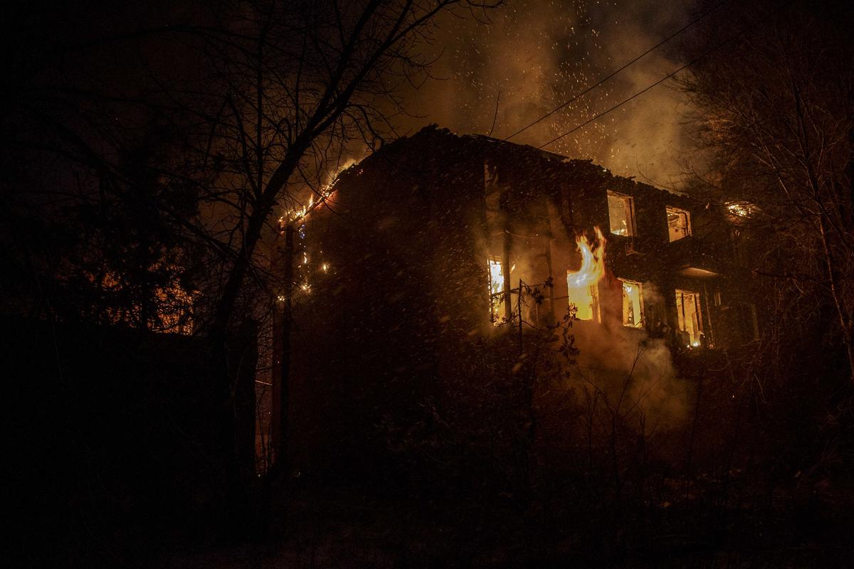 A fire broke out on a building after Russian shelling as military mobility continues within the Russian-Ukrainian war in Bakhmut, Ukraine on February 15, 2023. Photo: Marek M. Berezowski / Anadolu Agency / Getty Images