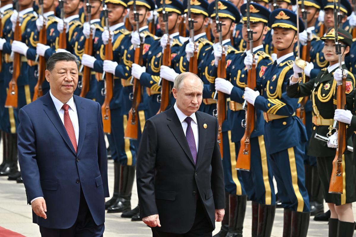 Vladimir Putin attends a welcome ceremony with Chinese President Xi Jinping outside the Great Hall of the People in Beijing, China, 16 May 2024. Photo: EPA-EFE/SERGEY BOBYLEV / SPUTNIK / KREMLIN POOL