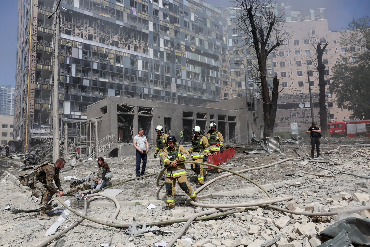 Emergency workers clear rubble from the Okhmatdyt Children’s Hospital following a direct hit on the facility on Monday. Photo: Gleb Garanich / Reuters / Scanpix / LETA