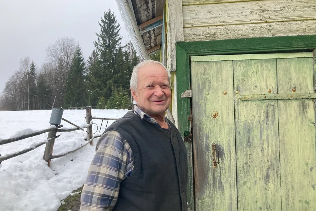 Mikhail by his home in Budushchee. Photo: Irina Garina