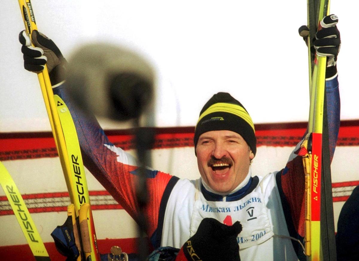 A jubilant Lukashenko celebrates after he and his team mates win a 4x5km relay race in an amateur cross country skiing event in Raubichi, outside Minsk, 3 February 2001. Photo: EPA PHOTO EPA / MAXIM MALINOVSKY