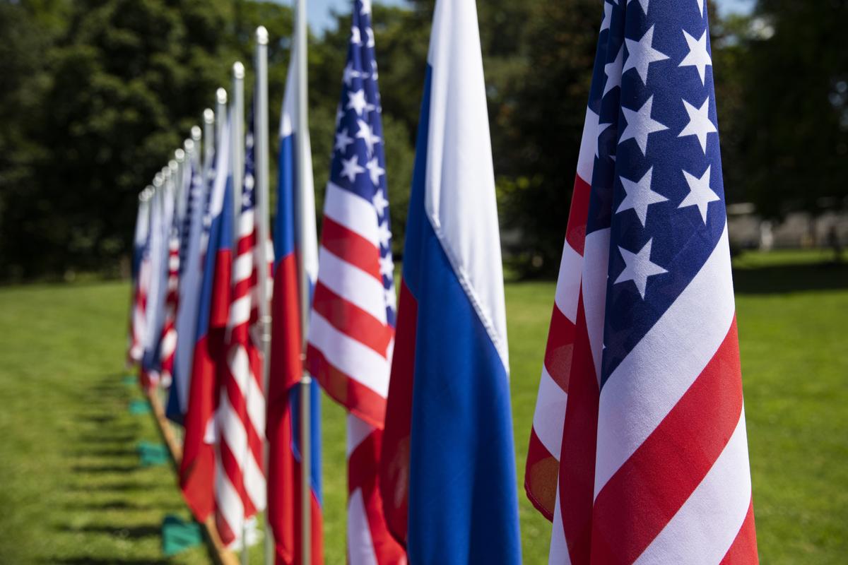 US and Russian flags outside a Swiss government villa outside Geneva where a summit between US President Joe Biden and Russian President Vladimir Putin took place on 16 June 2021. Photo: EPA-EFE/PETER KLAUNZER