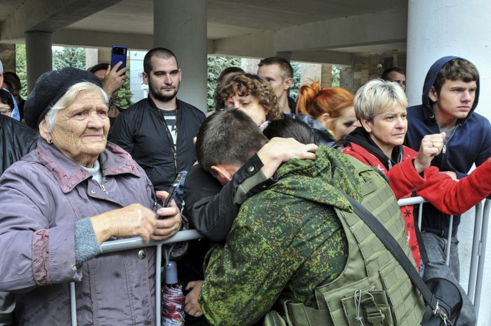A Russian conscript says goodbye to family outside a recruiting office in Bataysk, Rostov region, 26 September 2022. Photo: EPA-EFE/ARKADY BUDNITSKY