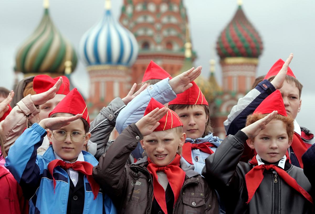 Russian school children give a salute on Moscow’s Red Square. Photo: EPA / SERGEI CHIRIKOV