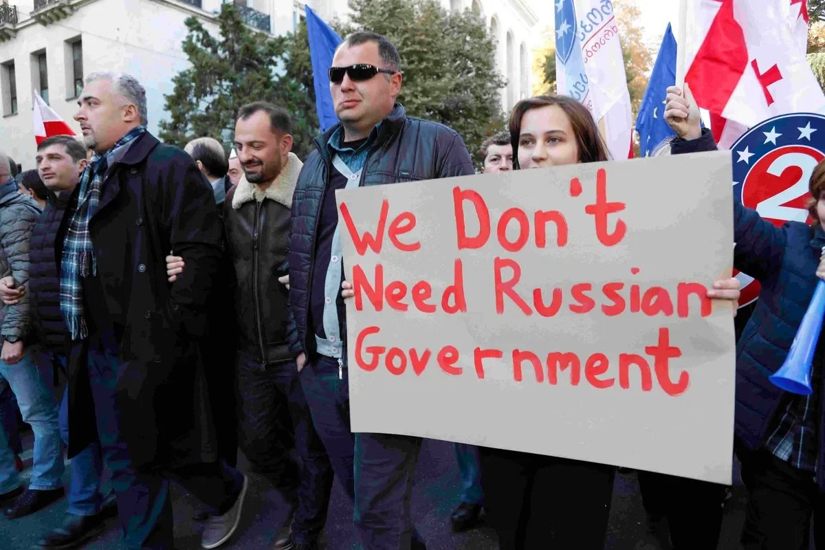 A protester holding a poster reading “We Don’t Need Russian Government”, Tbilisi, 2019. Photo: EPA-EFE / ZURAB KURTSIKIDZE