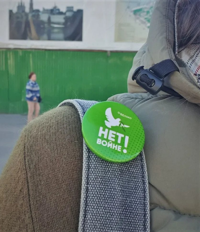A “No to war” pin on Polina Barinova’s backpack