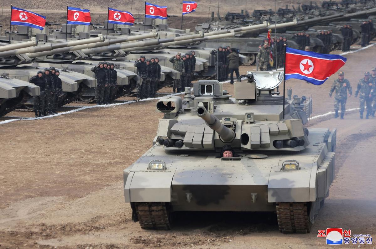 North Korea dictator Kim Jong Un sits inside a battle tank during a training competition, 13 March 2024. Photo: EPA-EFE / KCNA