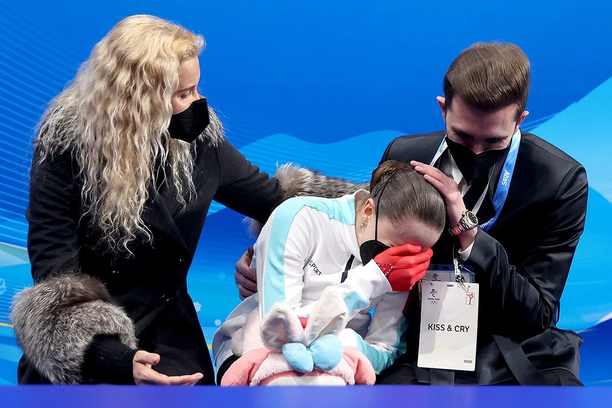 Kamila Valieva with choreographer Daniil Gleichengauz (right) and coach Eteri Tutberidze (left) after the women’s free skate competition at the 2022 Winter Olympics in Beijing, 17 February 2022. Photo: Matthew Stockman / Getty Images