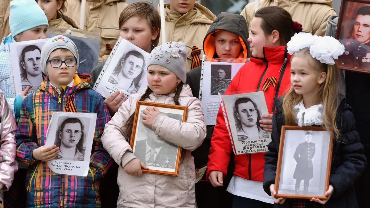 Pupils at a school parade with portraits of relatives who fought in the Great Patriotic War, Leningrad region, northwestern Russia, 4 May 2023. Photo: Andrey Bok / Kommersant / Sipa USA / Vida Press