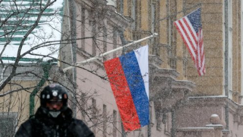 A Russian flag flies near the US flag on the US Embassy in Moscow, 6 November 2024. Photo: EPA-EFE/YURY KOCHETKOV