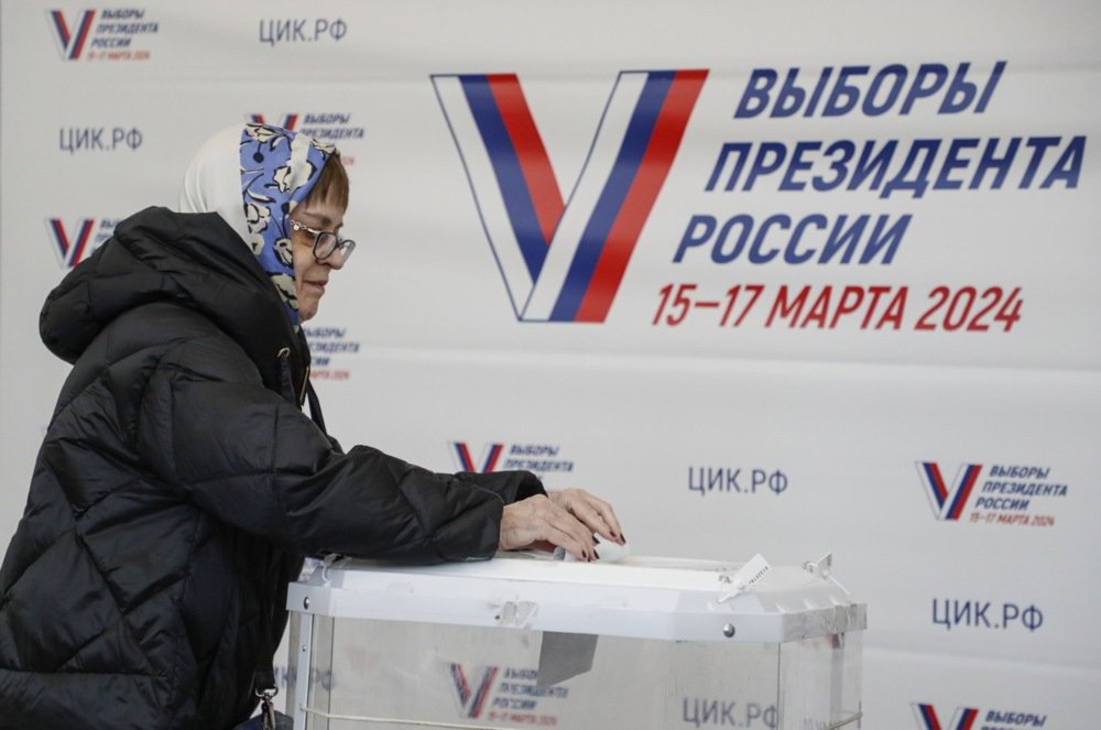 A woman casts her ballot at a polling station in Moscow on Friday. EPA-EFE/MAXIM SHIPENKOV